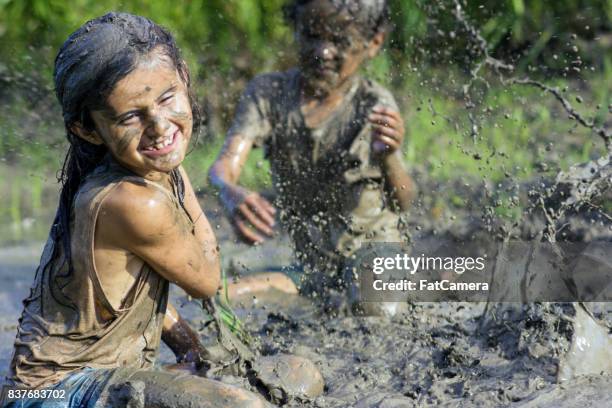 mud fight! - mud stock pictures, royalty-free photos & images