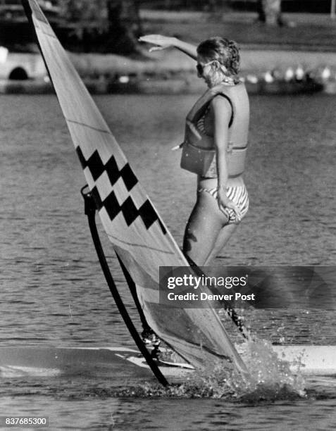 Karen Jensen on her first lesson of Wind surfing loses it and falls over. She said it was great and the water is wonderful Credit: The Denver Post