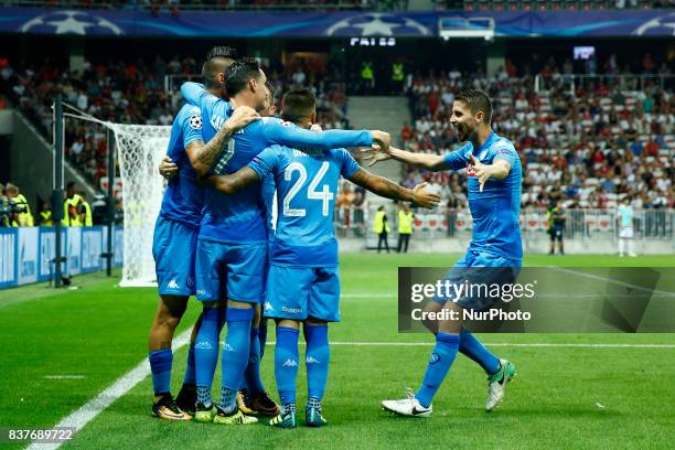 Napoli's Spanish striker Jose Maria Callejon celebrates with teammates after scoring a goal during the UEFA Champions League play-off football match...