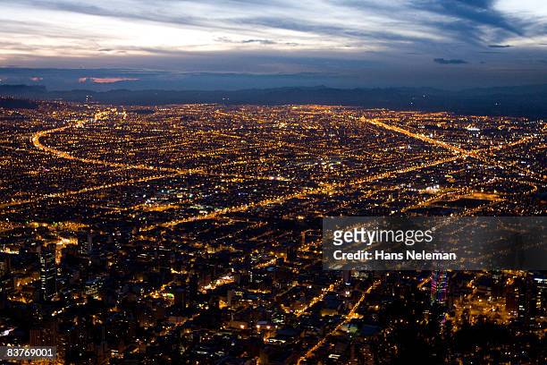 view of bogota city in the night - bogota stock pictures, royalty-free photos & images