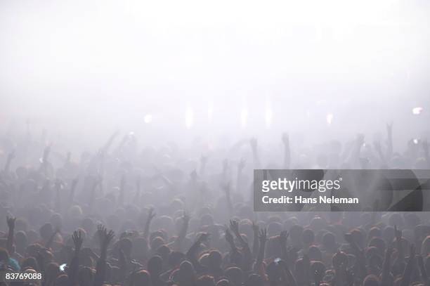 fans cheering at a rock concert - person saluting stock pictures, royalty-free photos & images
