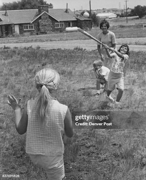 Cindy Bender 734 Owens St., Lakewood, gets a hit! Pitcher is Jo Ann Hilton of 591 S. Simms St. Green Mountain, and catcher is Lisa Schneider of 8793...