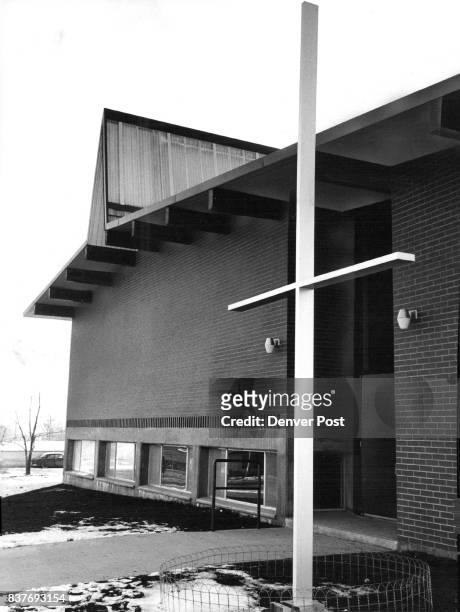 Westminster Methodist Church, W. 76th Ave. And King St., has a V-shaped steeple with wood on one side, glass on the other. Stark white cross set in...