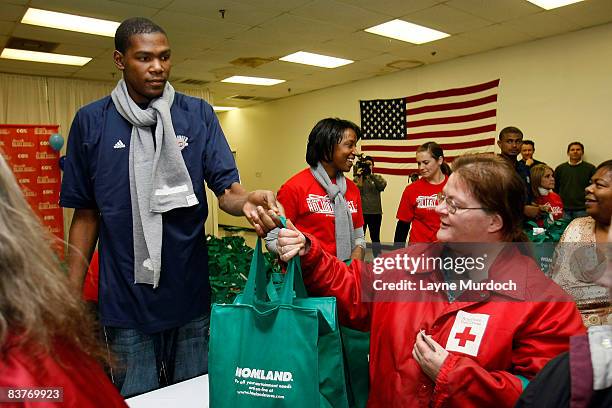 Kevin Durant of the Oklahoma City Thunder participates in the Oklahoma City Thunder Holiday Assist charitable events and donations program with a...