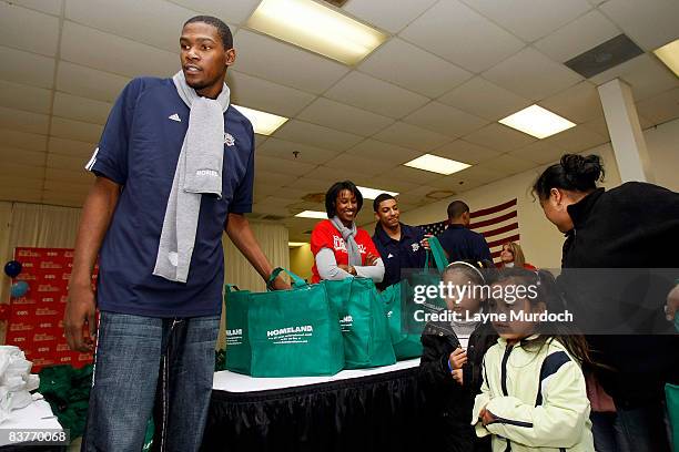 Kevin Durant of the Oklahoma City Thunder participates in the Oklahoma City Thunder Holiday Assist charitable events and donations program with a...