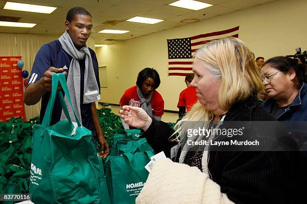 Kevin Durant of the Oklahoma City Thunder participates in the Oklahoma City Thunder Holiday Assist charitable events and donations program with a...