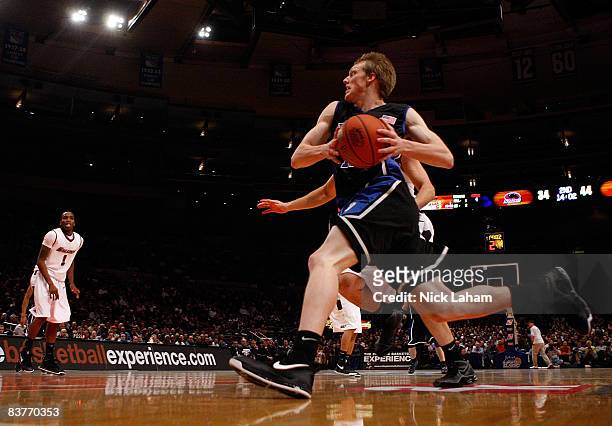 Kyle Singler of the Duke Blue Devils drives to the basket against the Southern Illinois Salukis on November 20, 2008 at Madison Square Garden in New...