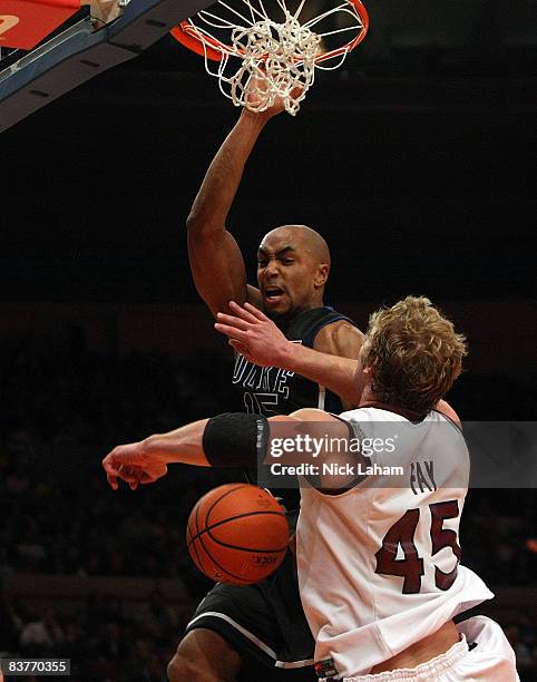 Gerald Henderson of the Duke Blue Devils dunks over Carlton Fay of the Southern Illinois Salukis on November 20, 2008 at Madison Square Garden in New...