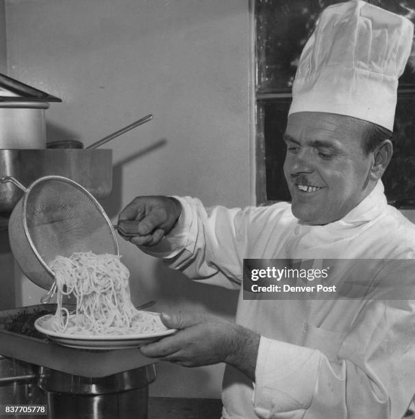 Romano Giugovazo, former chef on the Italian luxury liner Andrea Doria, finds spaghetti is popular in any language as he prepare his specialty in a...
