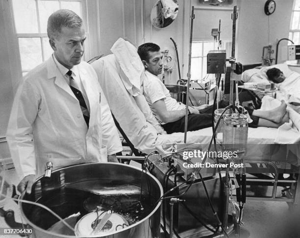 Dr. C. F. Gutch Observes Artificial Kidney Unit At University Of Colorado Medical Center Patients are Bob Grenfell of Idaho Springs, Colo., and Mrs....