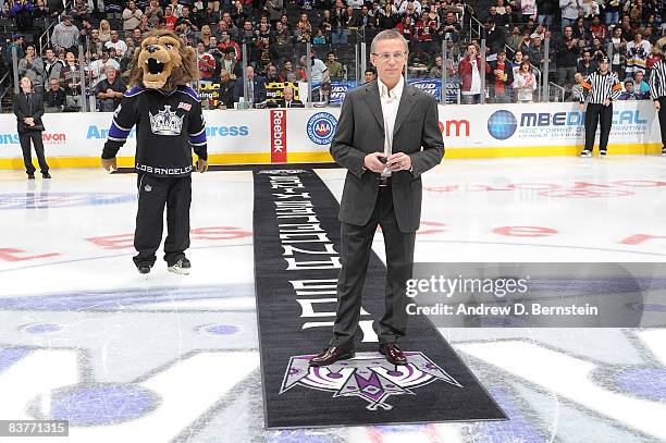 Newly elected Hockey Hall of Fame member, Igor Larionov, participates in the Russian Heritage Night ceremonial puck drop prior to the game between...