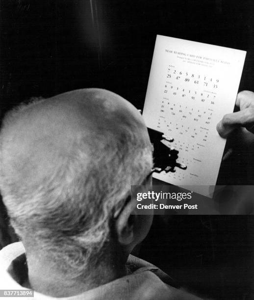 After being fitted with high-power convex lens, Verne Rogers, 81 and partially blind, was able to read newspaper and Bible-size print for the first...