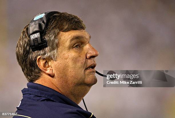 Head coach Paul Johnson of the Georgia Tech Yellow Jackets watches the action on the scoreboard during the game against the Miami Hurricanes at Bobby...