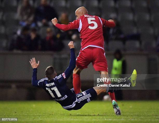 Taylor Regan of United makes contact with Mitchell Austin of the Victory during the round of 16 FFA Cup match between Adelaide United and Melbourne...