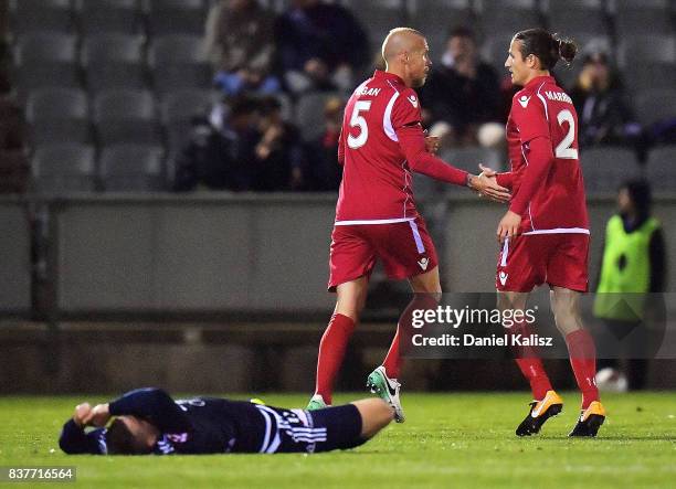 Taylor Regan of United makes contact with Mitchell Austin of the Victory during the round of 16 FFA Cup match between Adelaide United and Melbourne...