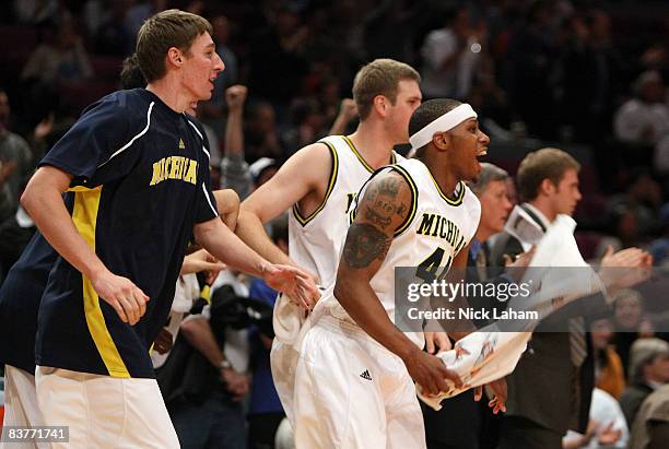 The Michigan Wolverines bench celebrate a basket against the UCLA Bruins at Madison Square Garden November 20, 2008 in New York City, New York.