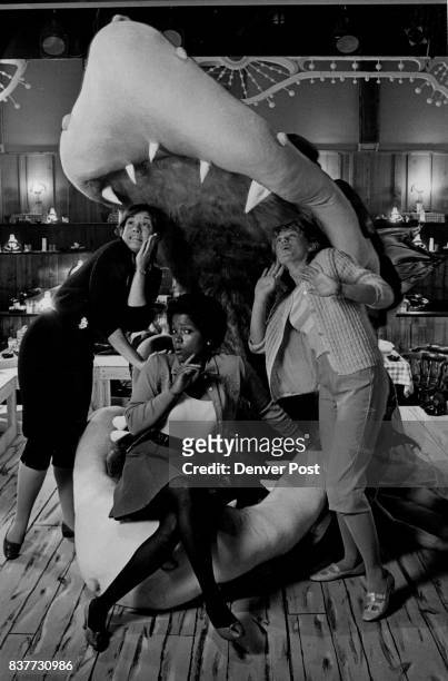 Little Shop of Horrors actresses Maureen McHale Carol Monroe, and Janet Frost feign terror at the hands of man eating plant "Audrey II" played by...