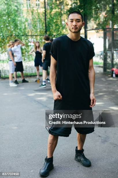 portrait of a young athletic man - handsome man serious tshirt stock-fotos und bilder