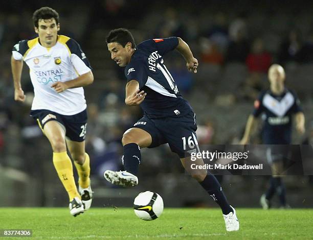 Carlos Hernandez of the Victory passes the ball during the round 12 A-League match between the Melbourne Victory and the Central Coast Mariners at...