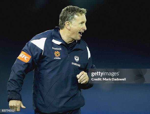 Ernie Merrick coach of the Victory encourages his team during the round 12 A-League match between the Melbourne Victory and the Central Coast...