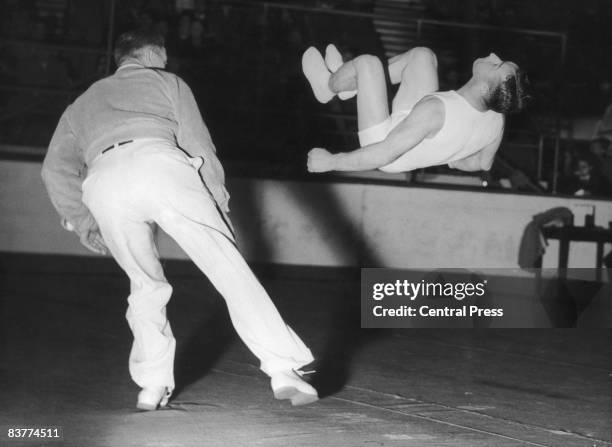 Swiss gymnast Michael Reusch during the Free Exercises at the Empress Hall, Earl's Court, at the London Summer Olympics, 12th August 1948.