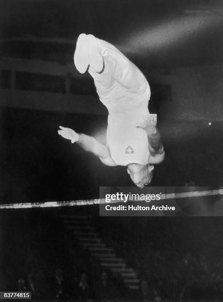 Swiss gymnast Emil Studer takes part in the Men's Individual Horizontal Bar event at the Empress Hall, Earl's Court, during the London Summer...