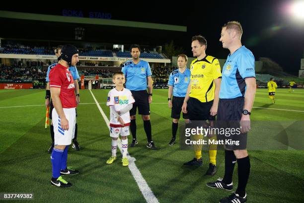 Captains Nicholas Stavroulakis of Sydney United 58 FC and Luke Byles of Heidleberg United take part in the coin toss during the FFA Cup round of 16...