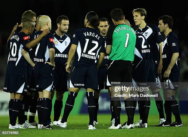 Victory players gather together during the round 12 A-League match between the Melbourne Victory and the Central Coast Mariners at the Telstra Dome...