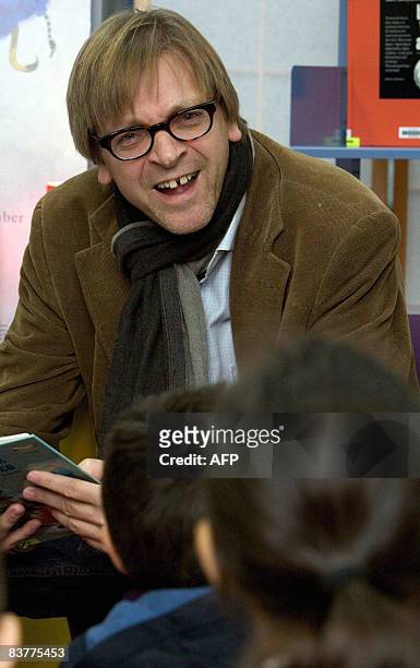 Former Belgian Prime Minister Guy Verhofstadt reads a story for children at the library Brugse Poort in Gent during the Reading breakfast of the Read...