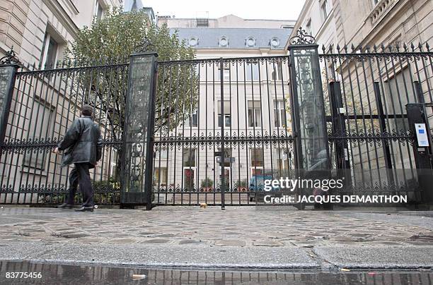 Man walks in front of the socialist headquarters in Paris, on November 21, 2008. Former presidential candidate Segolene Royal headed into a run-off...