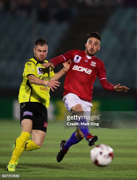 Yianni Fragogiannis of Sydney United 58 FC competes for the ball against Reuben Way of Heidleberg United during the FFA Cup round of 16 match between...