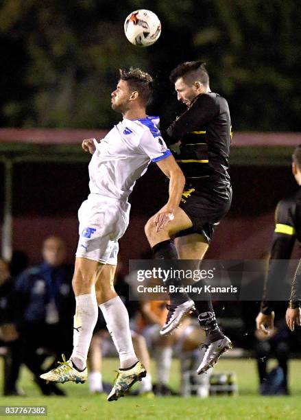 Jacob Boutoubia of Gold Coast City and Matthew Byrne of Moreton Bay compete for the ball during the FFA Cup round of 16 match between Moreton Bay...