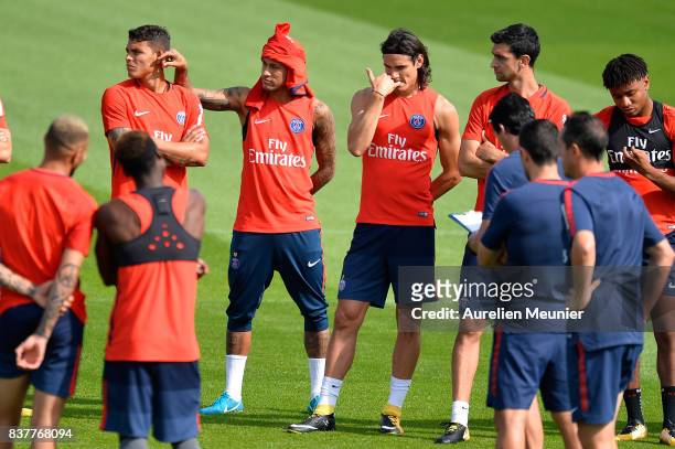 Thiago Silva, Neymar Jr, Edinson Cavani and Javier Pastore of Paris Saint-Germain listen to the Coach before a Paris Saint-Germain training session...