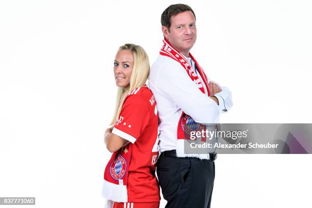 Mandy Islacker of Bayern Muenchen poses with Allianz Insurance Manager Robert Spulak during the Allianz Frauen Bundesliga Club Tour at FC Bayern...