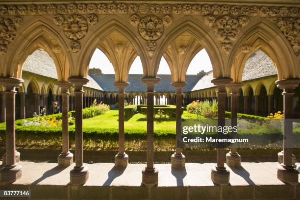 the cloister of the abbey - mont saint michel stock pictures, royalty-free photos & images