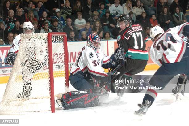 Chet Pickard of the Tri City Americans makes a save from Lucas Bloodoff of the Kelowna Rockets at the Kelowna Rockets on November 19, 2008 at...