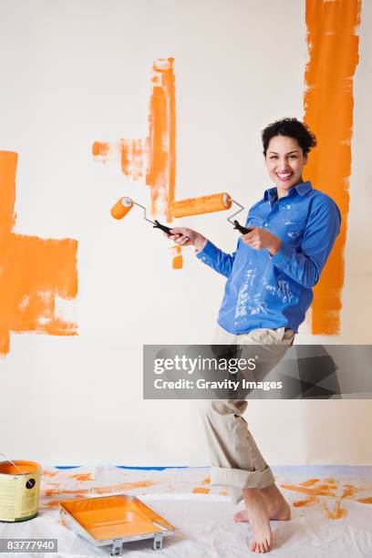 do it yourself  - holding paint roller stock pictures, royalty-free photos & images