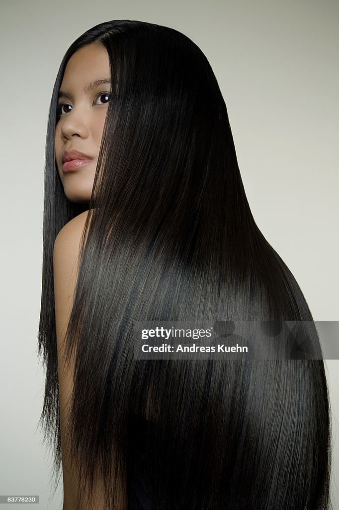 Woman with long shiny hair, profile.