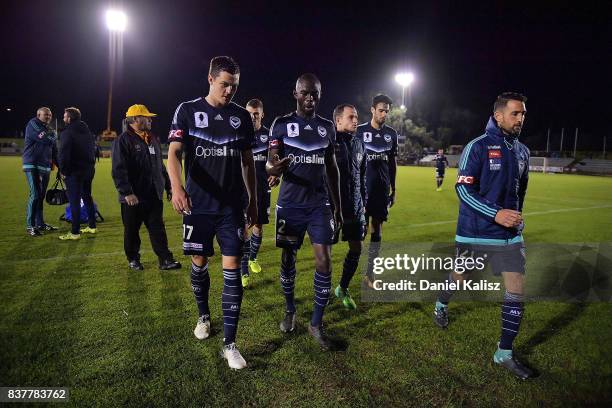 Melbourne Victory players walk from the field after the round of 16 FFA Cup match between Adelaide United and Melbourne Victory at Marden Sports...