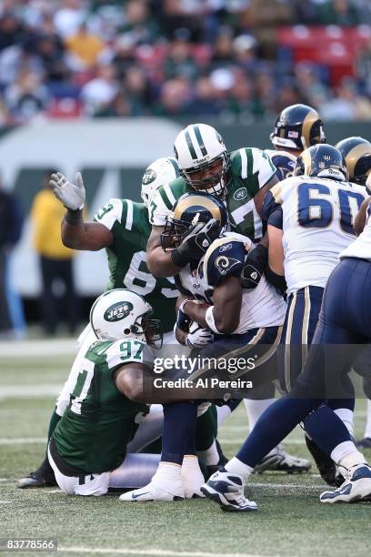 Nose Tackle Kris Jenkins and Linebacker Calvin Pace of the New York Jets make a stop against the St. Louis Rams on November 9, 2008 at Giants...