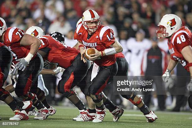 Quarterback Hunter Cantwell of the Louisville Cardinals looks to hand off theball during the Big East Conference game against the Cincinnati Bearcats...