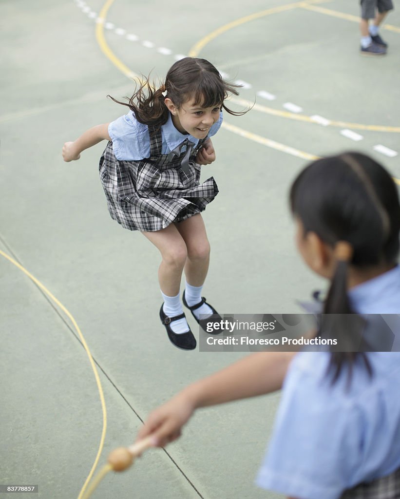 School girl skipping rope