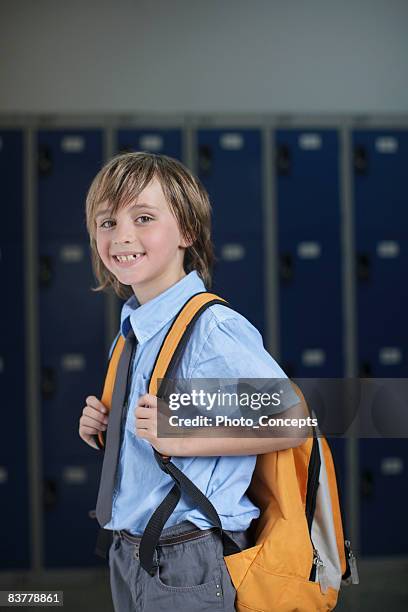 school boy holding backpack - independent school stock pictures, royalty-free photos & images