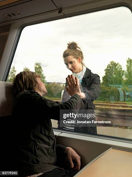 young couple on train - girlfriend leaving stock pictures, royalty-free photos & images