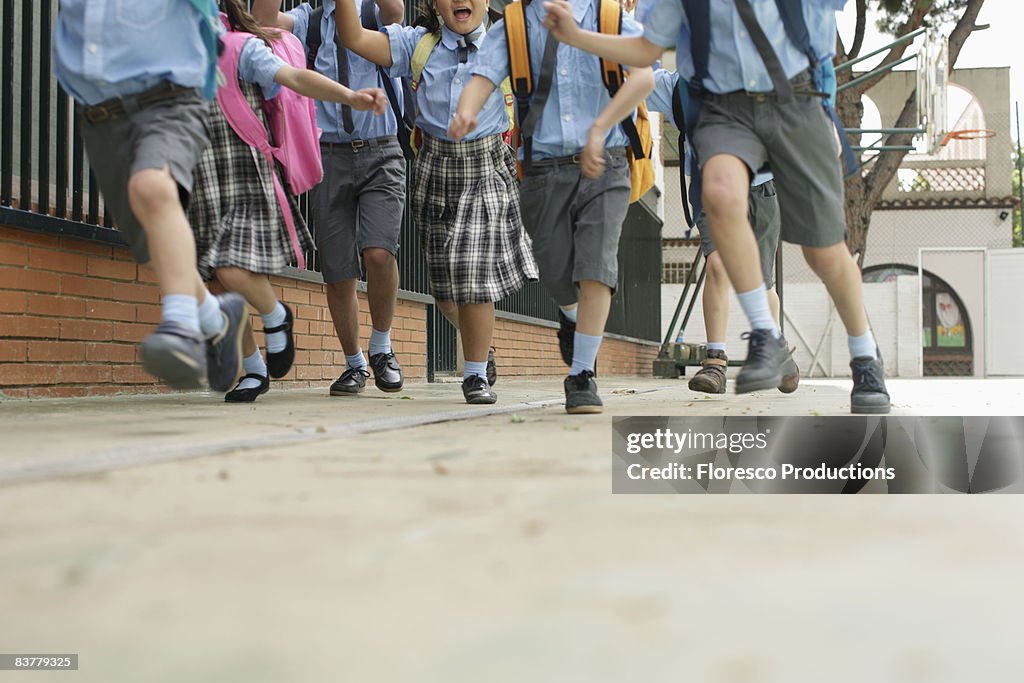 School children running low angle