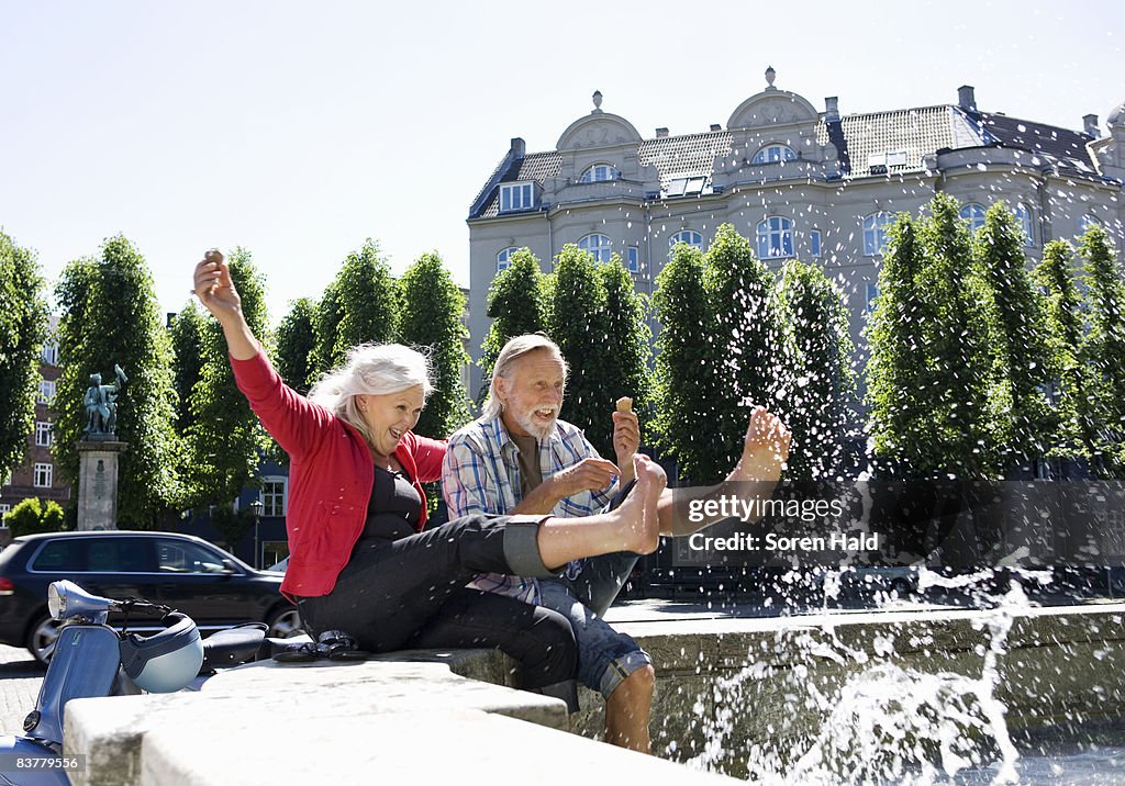 Couple splashing water 