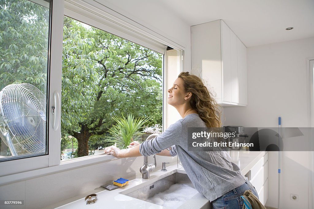 Woman at kitchen window
