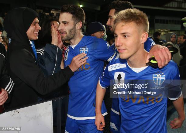 Brad Norton and Jesse Daley of South Melbourne of South Melbourne celebrate the win with fans during the FFA Cup round of 16 match between between...