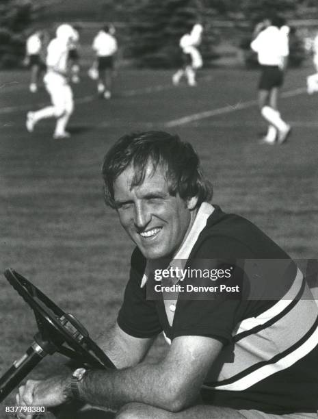 Al Kincade watchs from golf cart. Credit: The Denver Post