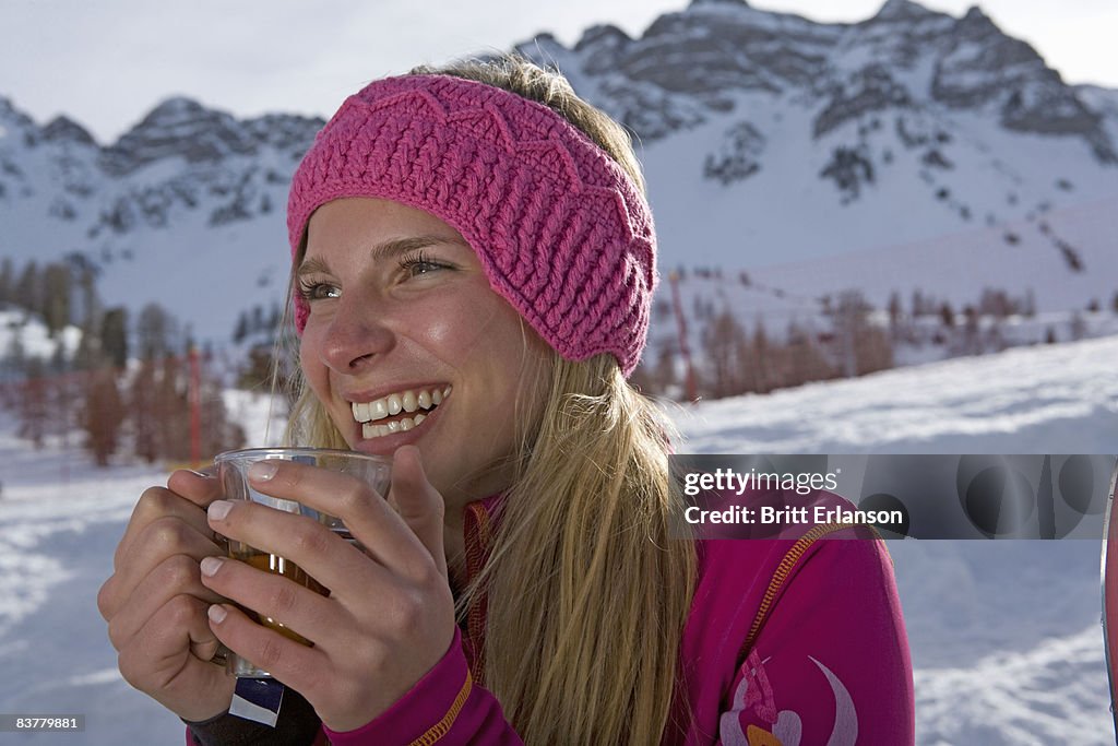 Girl drinking, smiling